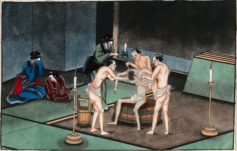 Japanese funeral customs: two attendants wearing loin-cloths support the body of a dead man while a third shaves his head.…