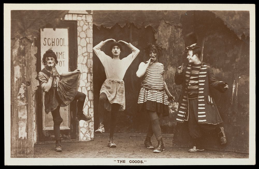 Amateur actors, some in drag, performing in the troupe "The Goods". Photographic postcard, 1918.