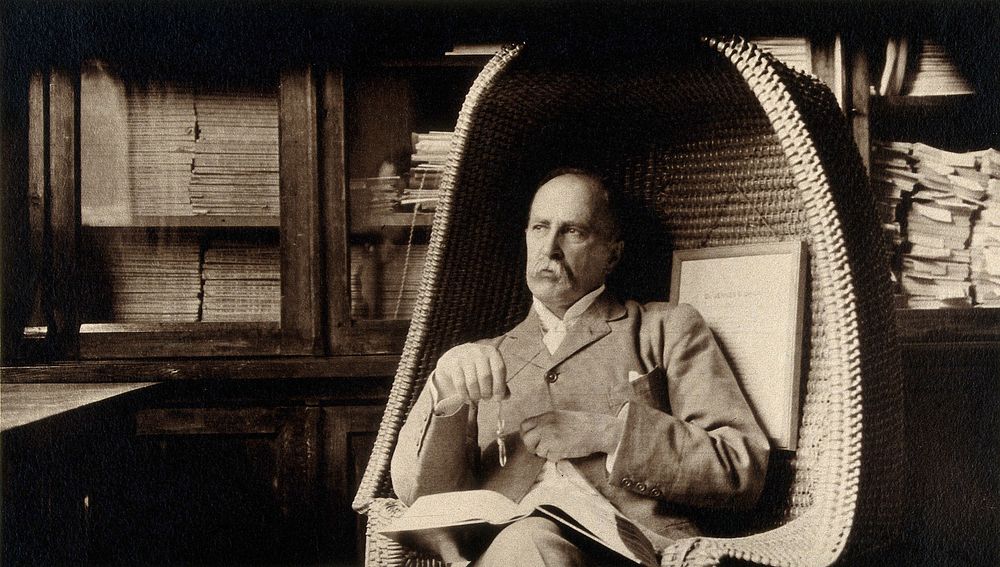 Sir William Osler in Edward Jenner's chair in the room of the Regius Professor of Medicine, University Museum, Oxford.…