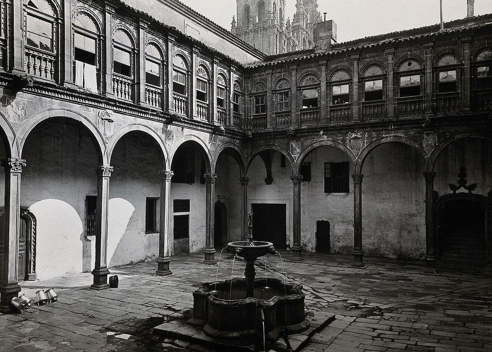 Hospital Real, Santiago de Compostela: view of the courtyard showing the fountain. Photograph, ca.1900.