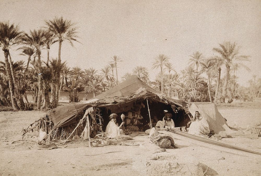 A tent with a Bedouin family in Northern Africa. Photograph.