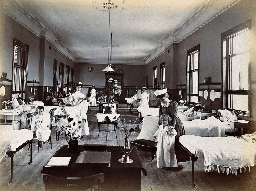 Johannesburg Hospital, South Africa: hospital ward with child patients and nurses. Photograph, c. 1905.