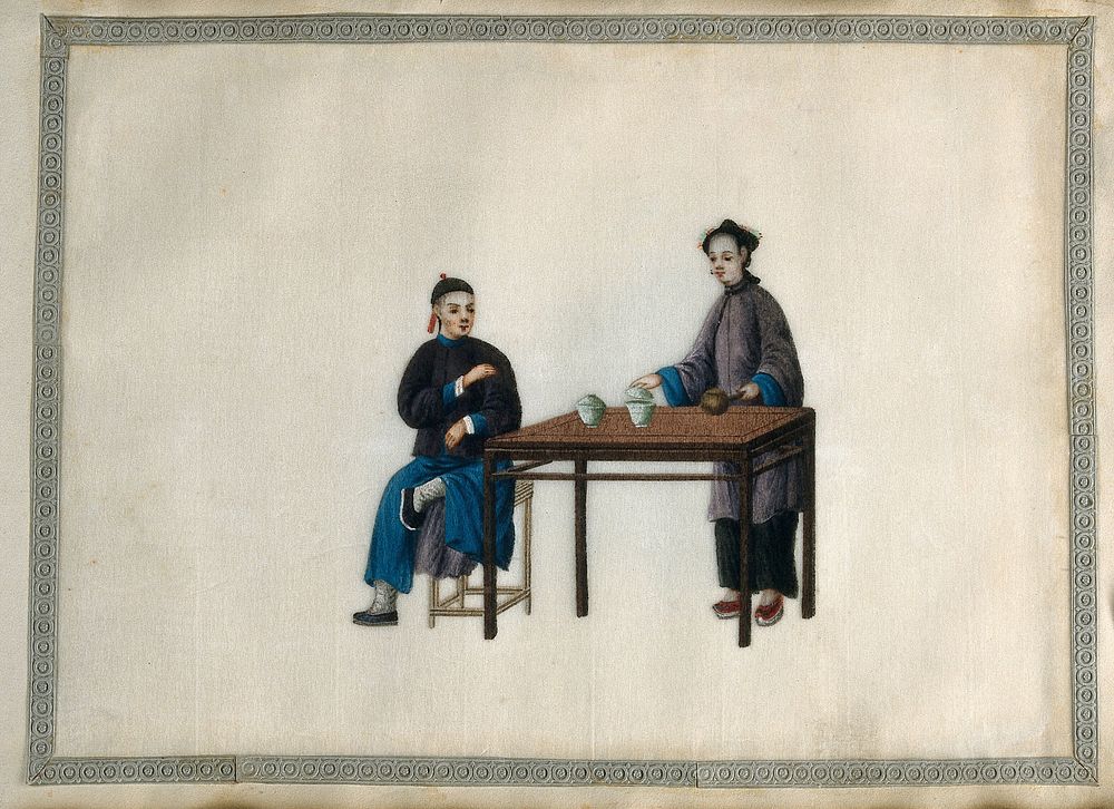 A woman preparing a tea drink by pouring hot water into two bowls containing tea leaves, for herself  and a man seated at a…
