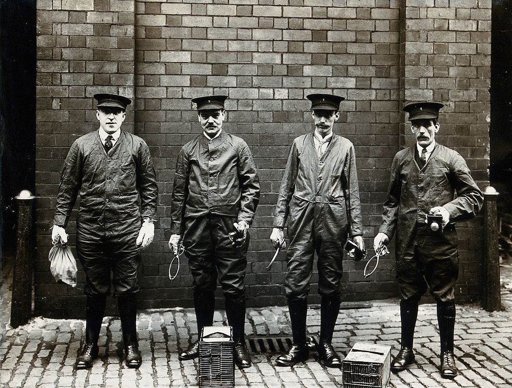 Liverpool Port Sanitary Authority rat-catchers dressed in protective clothing with traps and equipment, Liverpool, England.…