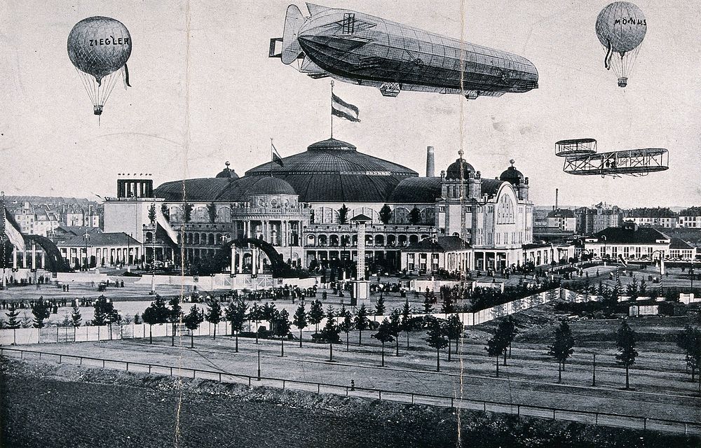 International Airship Exhibition, Frankfurt, 1909: a Zeppelin airship, an aeroplane and two balloons airborne over the…