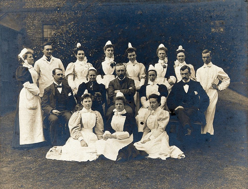 James Rutherford Morison with his staff: four men and eleven women. Photograph, ca. 1900.