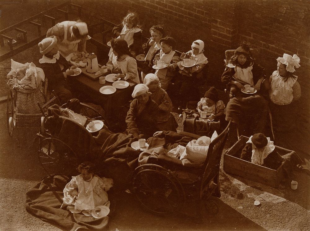 St Mary's Hospital, Plaistow: children having a meal outdoors. Photograph, 1904.