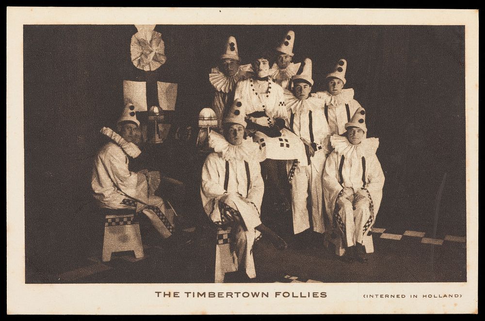 British prisoners of war, one in drag, posing for "The Timbertown Follies", at a prisoner of war camp in Groningen. Process…