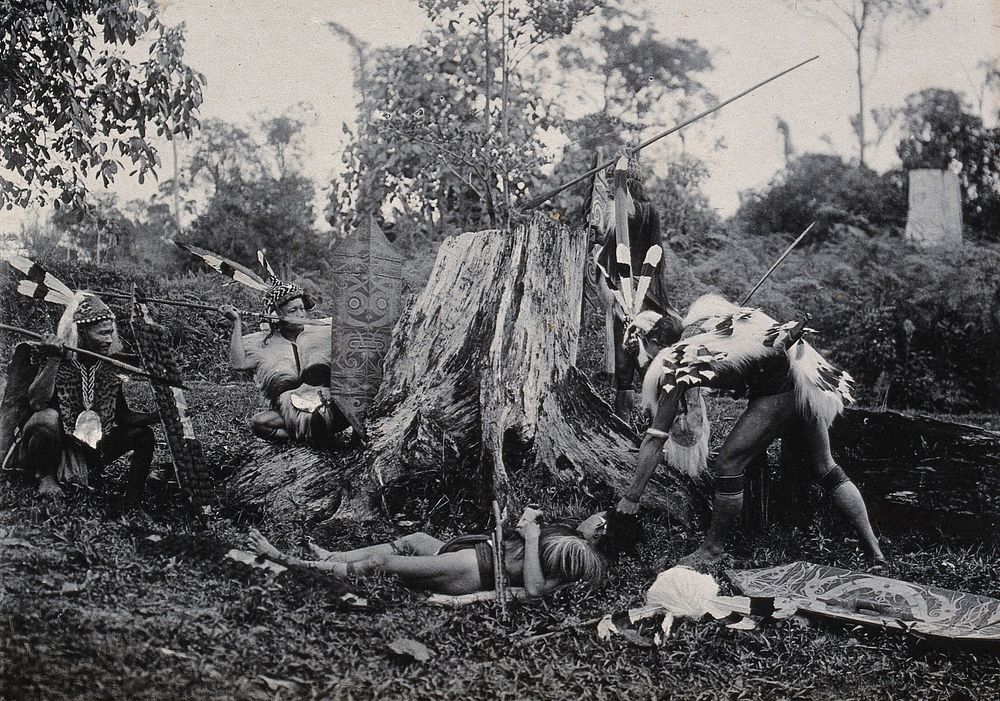 Sarawak: five Kenyah warriors in a warfare ritual. Photograph.