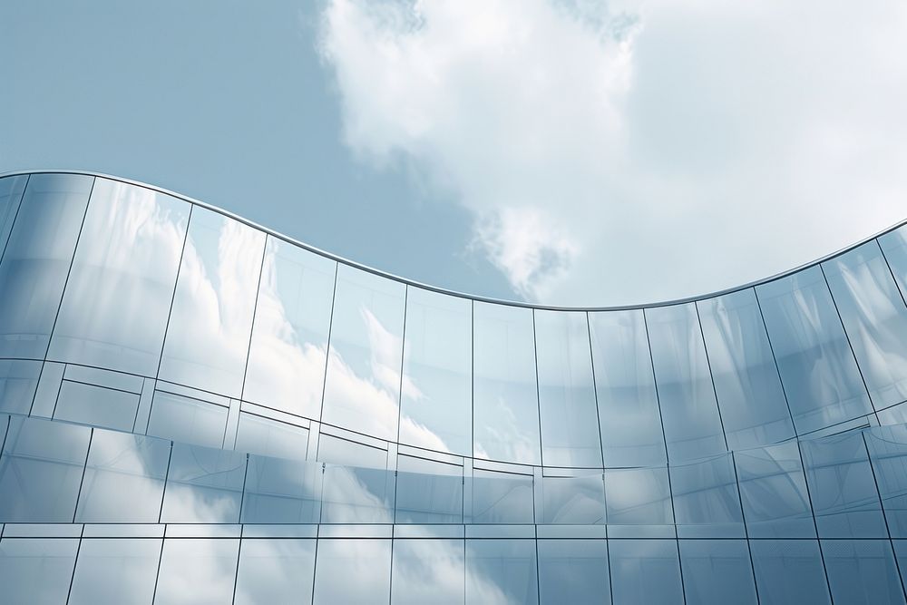View of the clouds reflected in the curve glass office building architecture outdoors city.