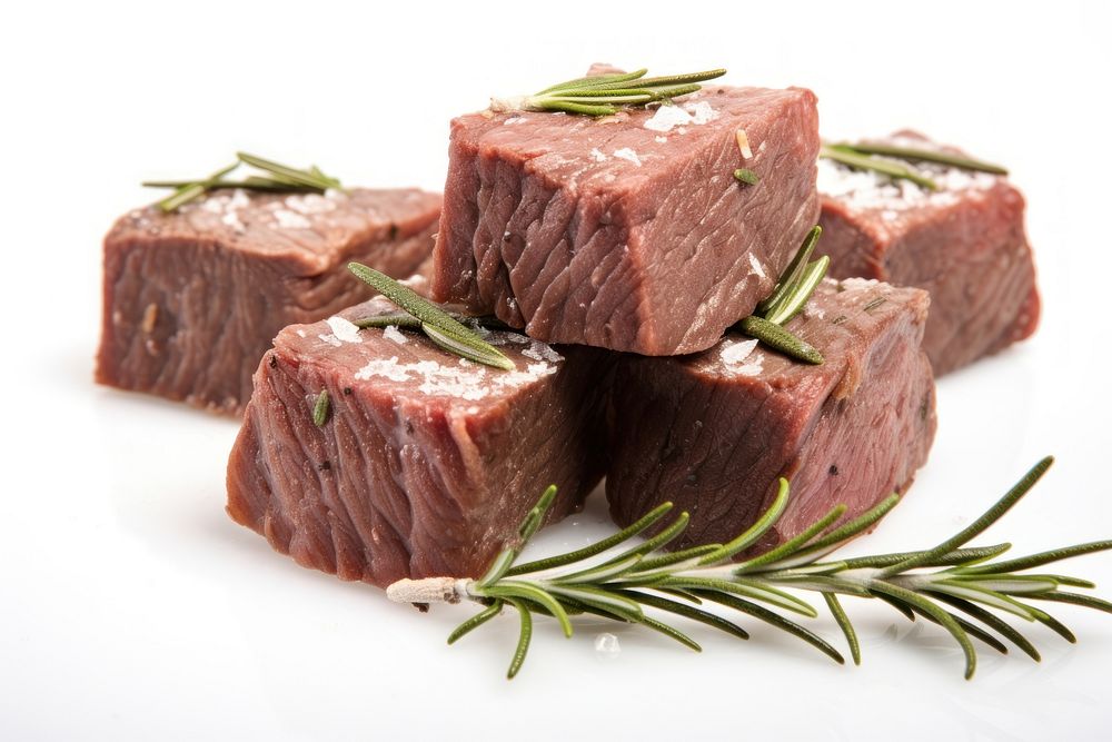 Beef cubes with rosemary meat food white background.