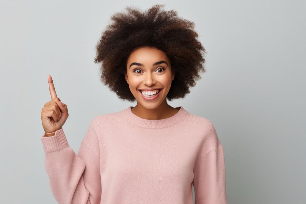 African American woman pointing portrait smile.