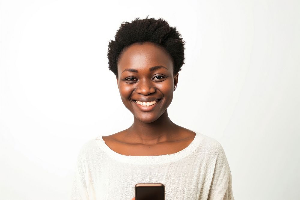 African woman with short haircut holding cellphone portrait smiling adult.