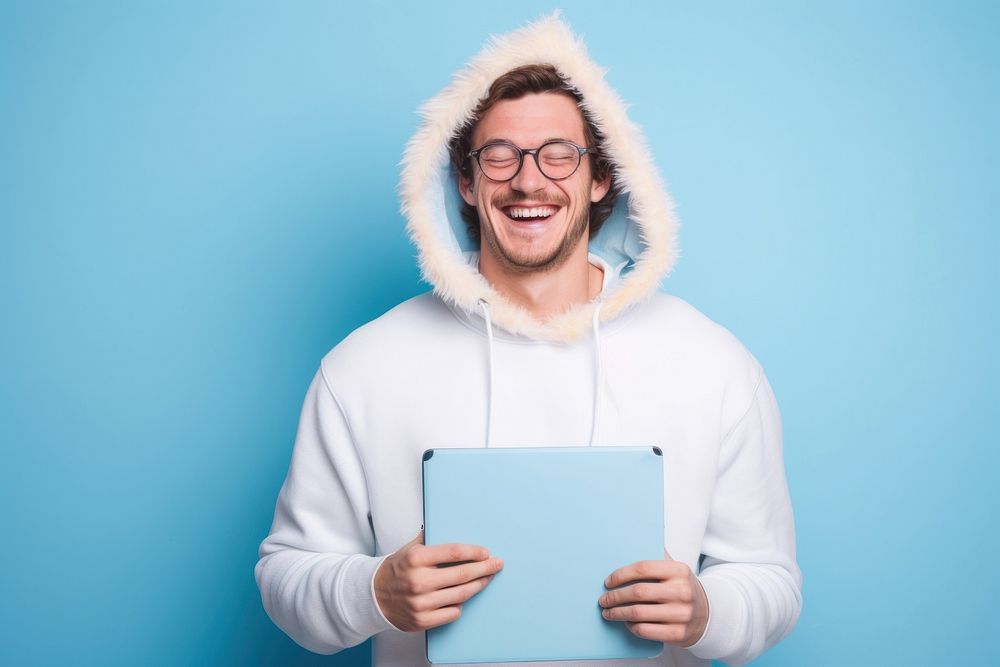Black man wear glasses and hoodie hold clipboard smile sweatshirt computer.