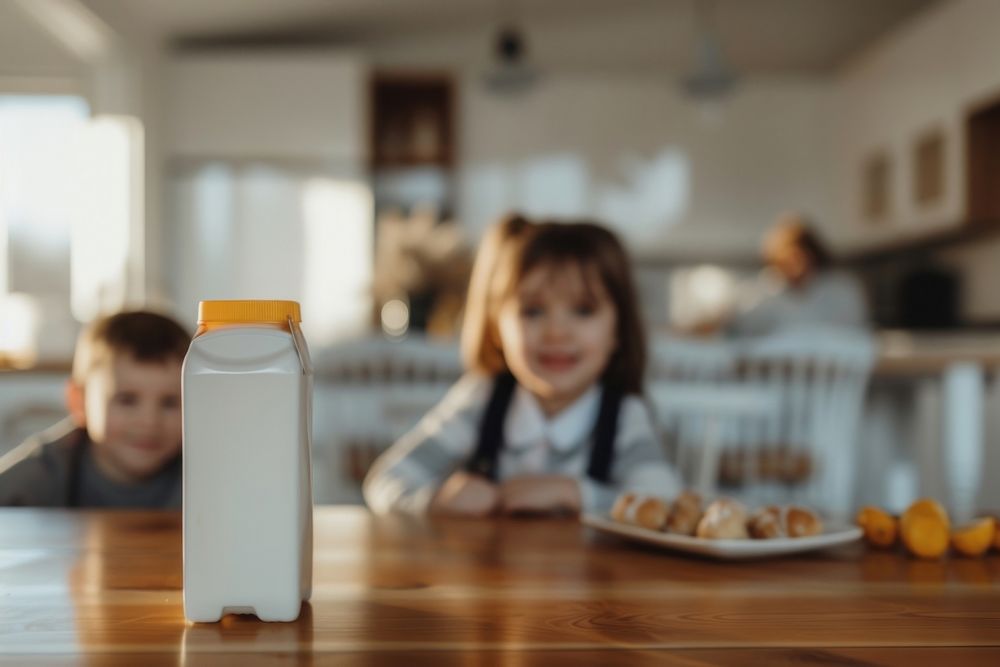 Milk carton bottle table child.