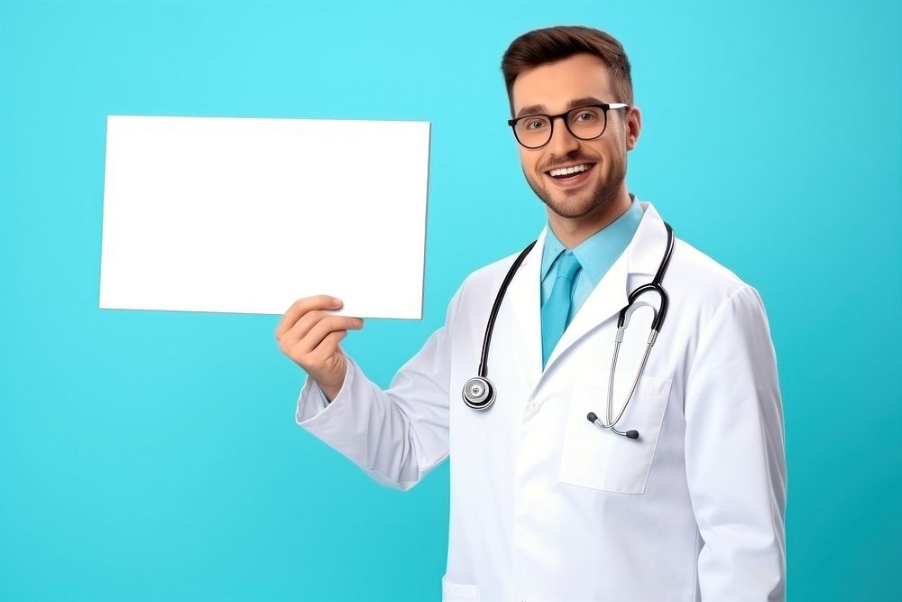 A smiling male doctor is pointing at floating in air mini white board glasses adult stethoscope.