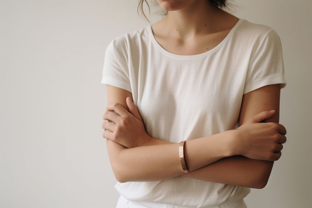 Bracelets on arms sleeve studio shot midsection.