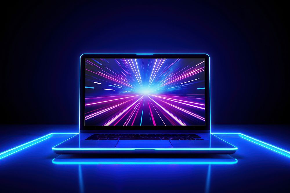 Laptop on blue neon table