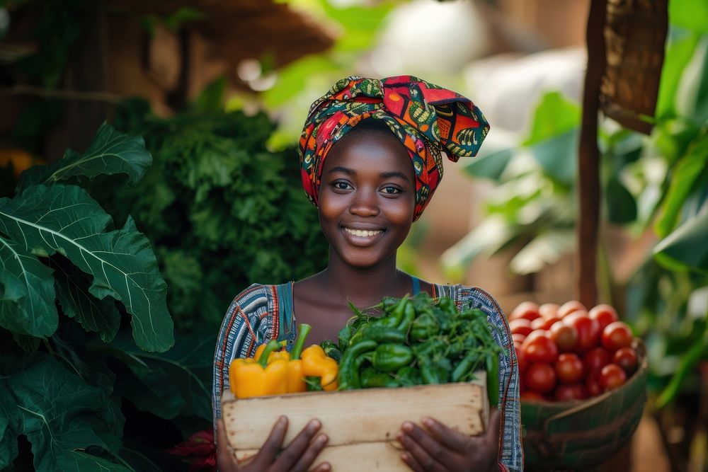 Young African woman with homemade vegetable box in hands portrait smile adult.