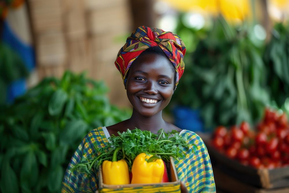 Young African woman with homemade vegetable box in hands portrait smile adult.