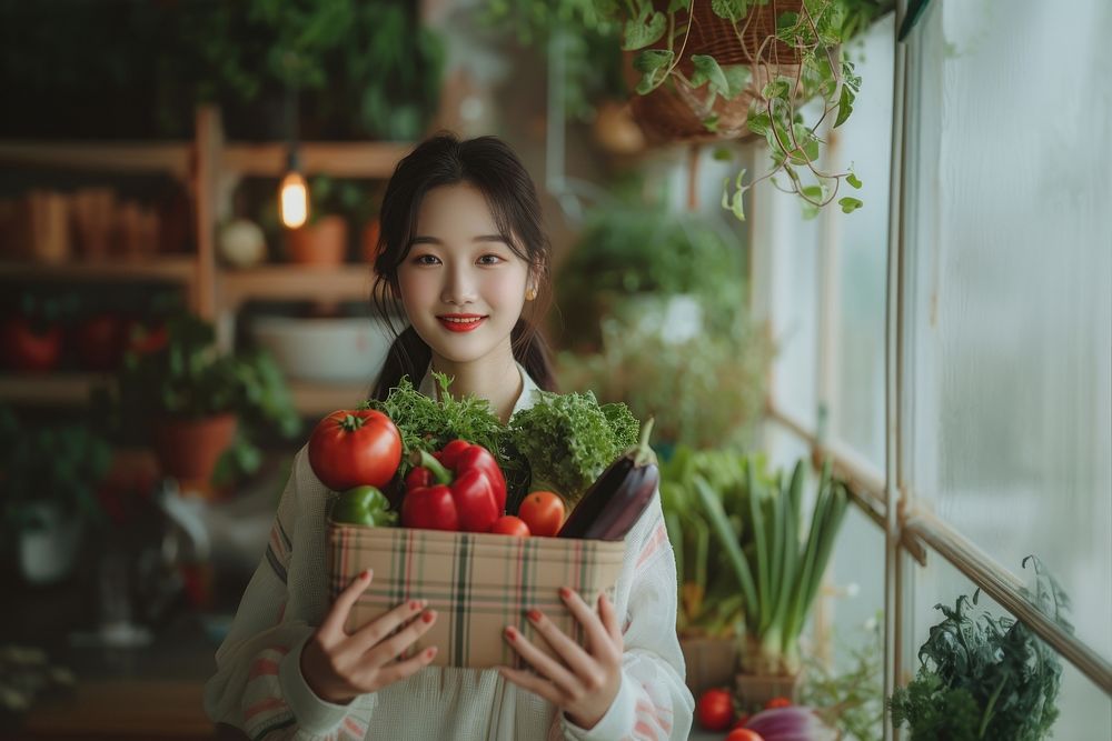 Young korean woman with homemade vegetable box in hands portrait adult plant.
