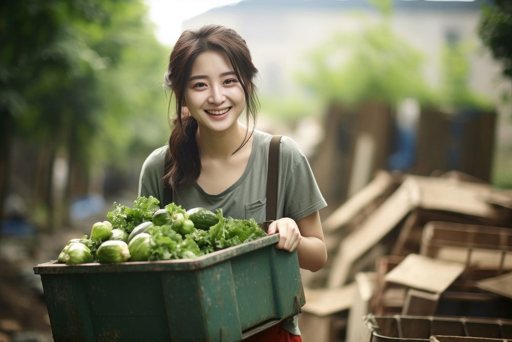 Chinese women carrying a vegetables box adult smile plant.