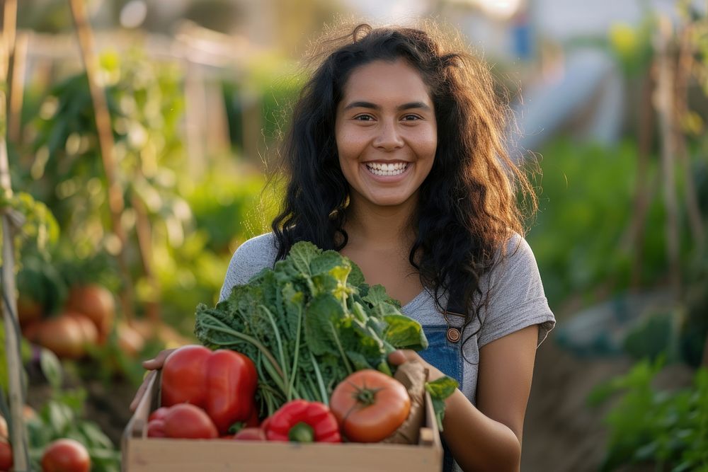Young Latino woman carrying a vegetable box smile adult plant.
