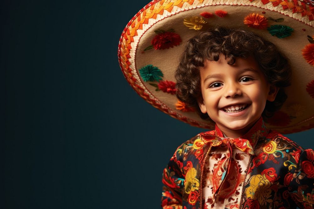 Happy kid in mexican costume sombrero portrait smile.