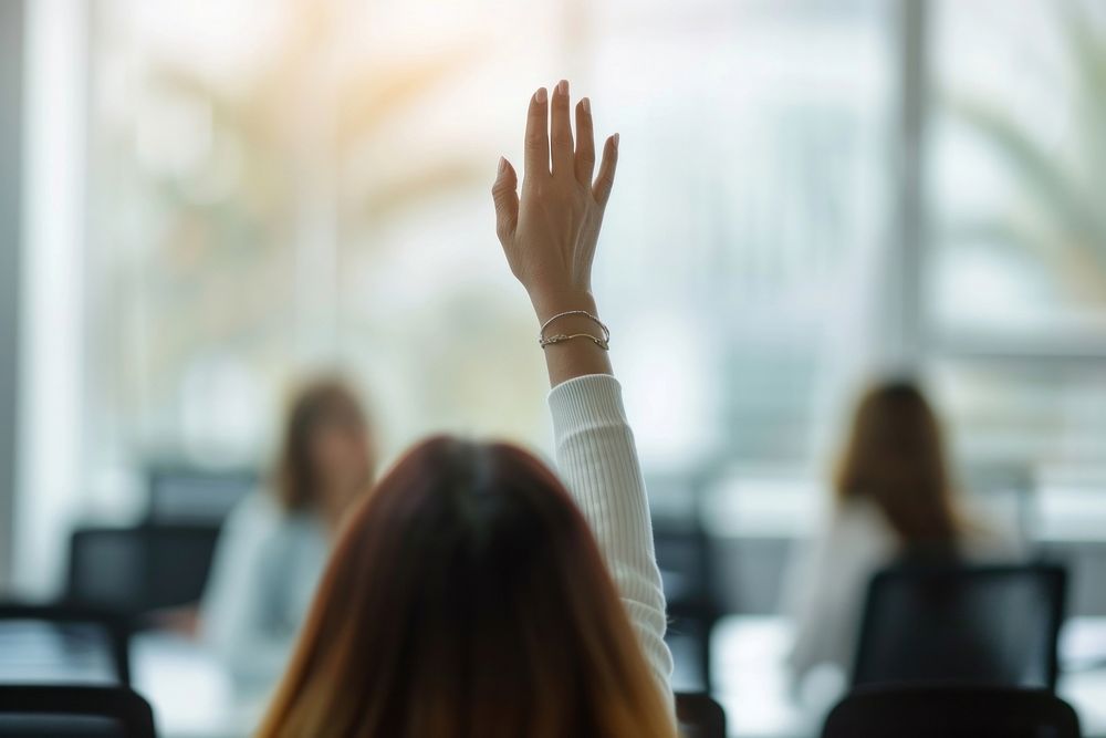 Extreme close up of business woman raising hands adult gesturing furniture.