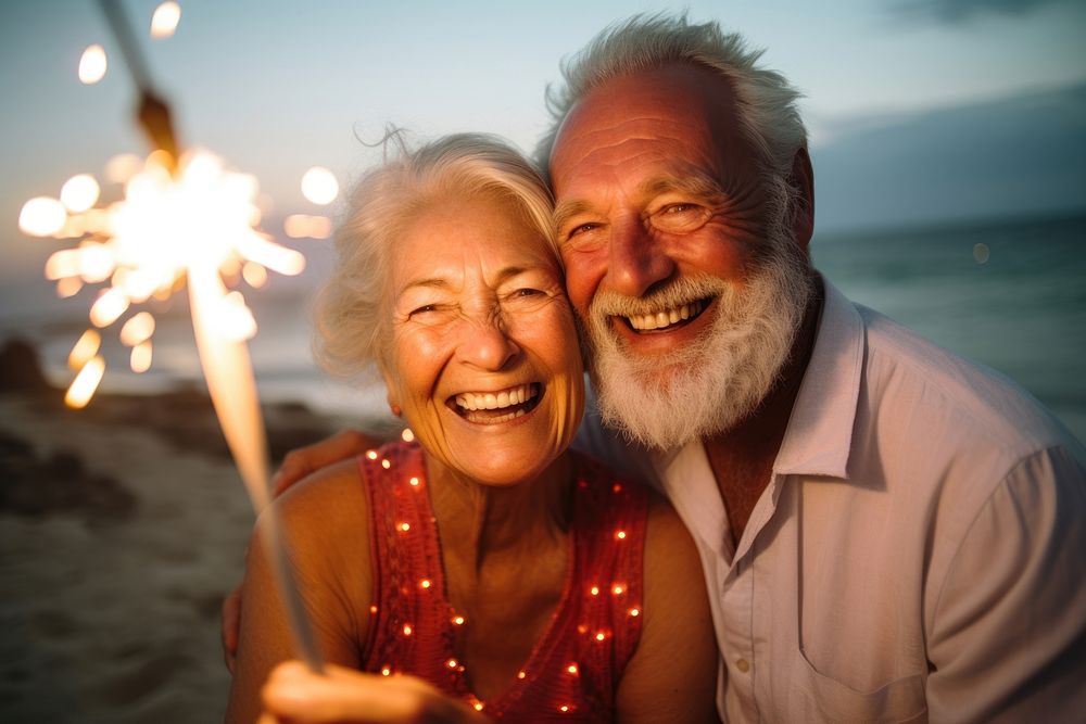 Senior couple laughing portrait outdoors.