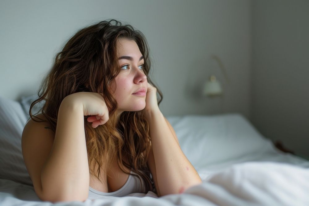 Woman thinking worried bedroom hand.