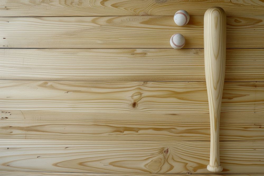 Baseball bat with balls sports wood flooring.