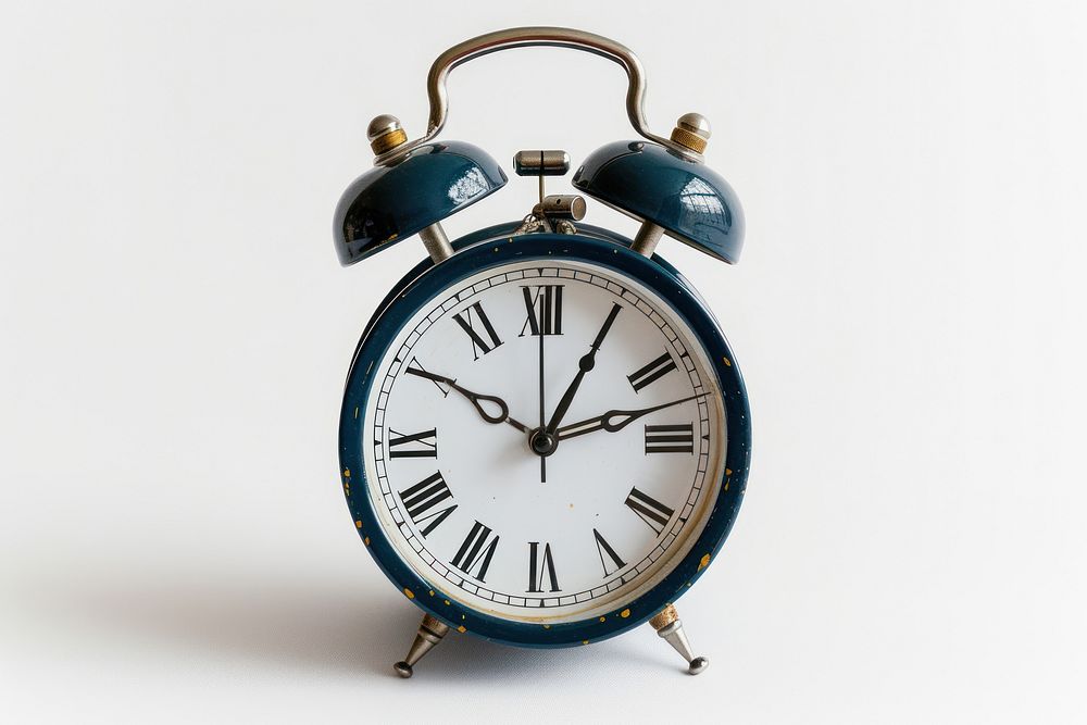 Twin bell alarm clock white background wristwatch furniture.