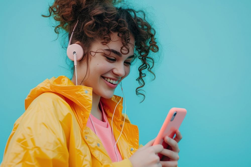 Woman listening music headphones looking smile.
