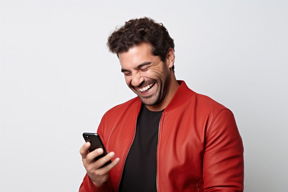 Men holding a phone smile and laugh happy laughing adult white background.