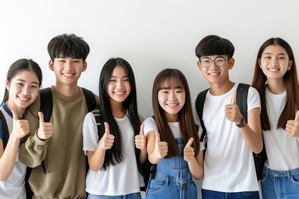 Group of asian student gesturing togetherness adolescence.