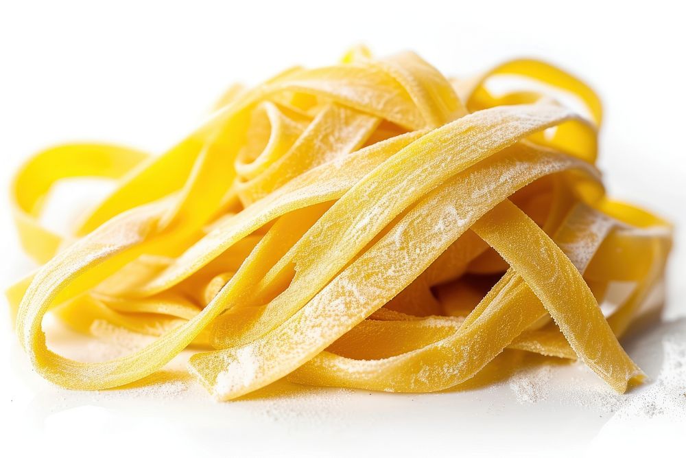 Raw fettuccine pasta from durum wheat food white background carbonara.