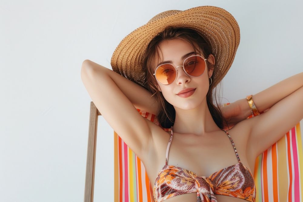 Young calm woman sunglasses swimwear bikini.