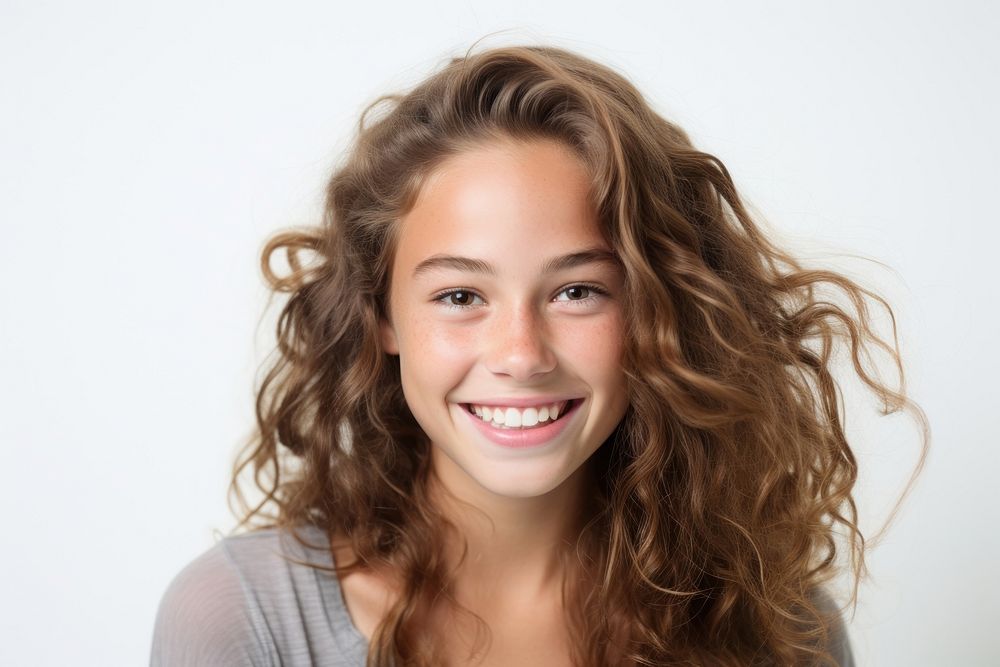 Young teenager girl smiling portrait adult smile.