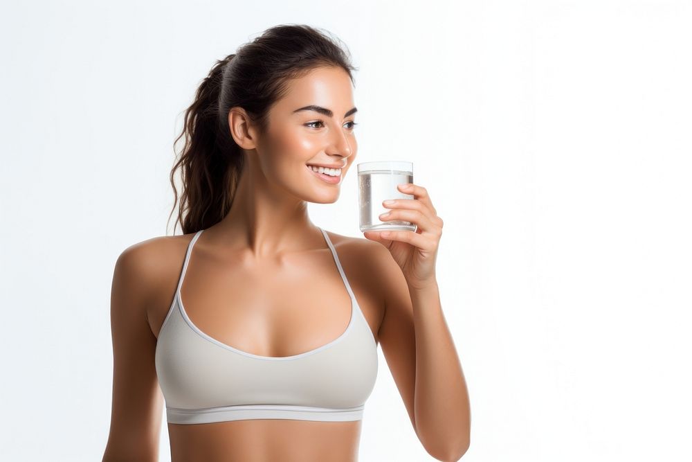 Young woman drinking water after exercising adult photo white background.