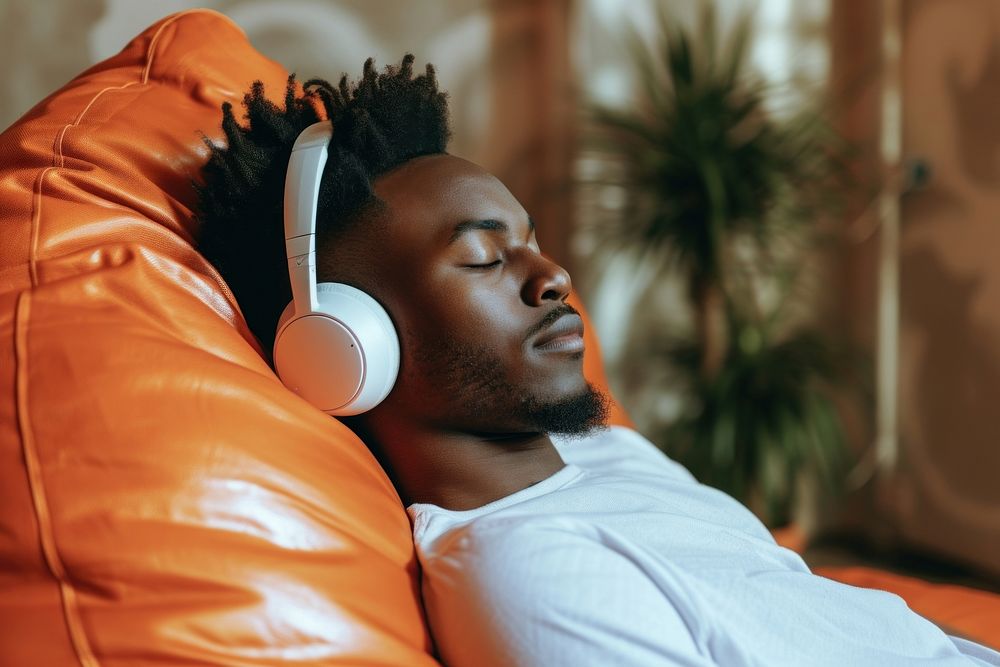 African american man headphones listening furniture.