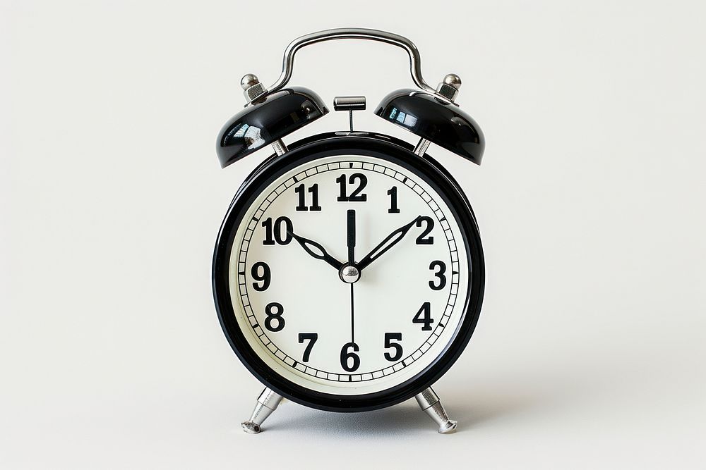 Twin bell alarm clock white background furniture deadline.