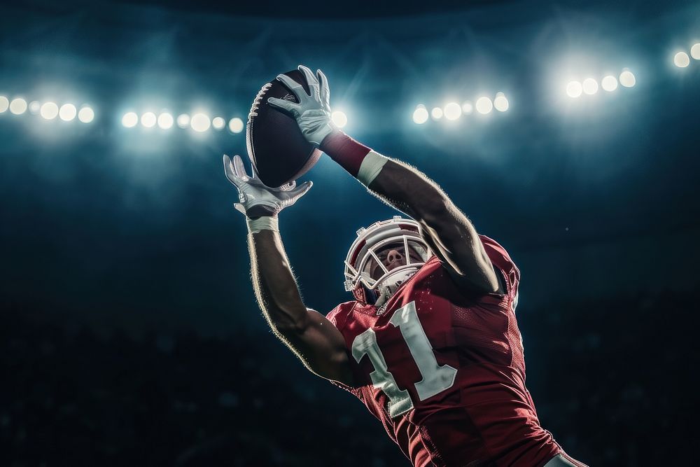 An American football player do touchdown under stadium spotlight helmet sports adult.