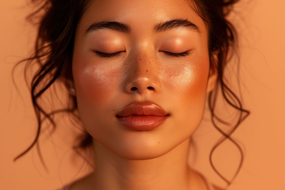 Asian woman posing inwards with closed eyes skin adult perfection.
