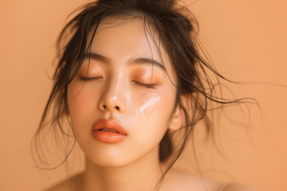 Asian woman posing inwards with closed eyes skin adult perfection.