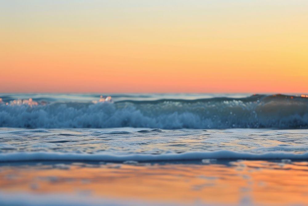 Photo of seawaves at the beach fall sunset with clear sky outdoors horizon nature.