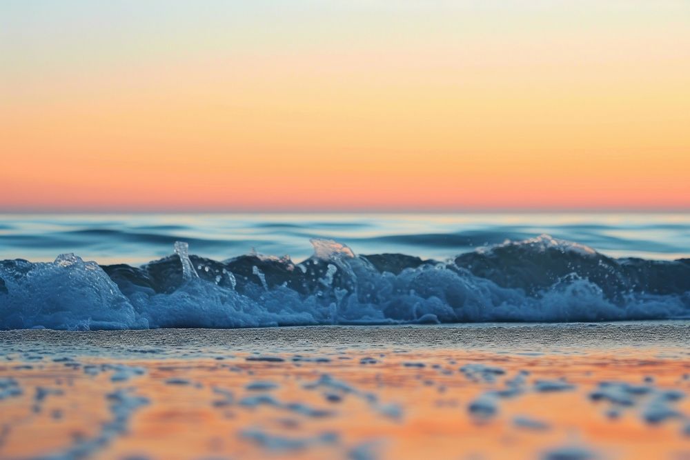Photo of seawaves at the beach fall sunset with clear sky outdoors horizon nature.