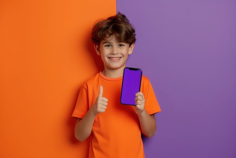 Boy showing phone screen child smile electronics.
