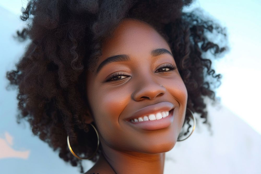 Black woman smile looking happy adult skin dreadlocks.