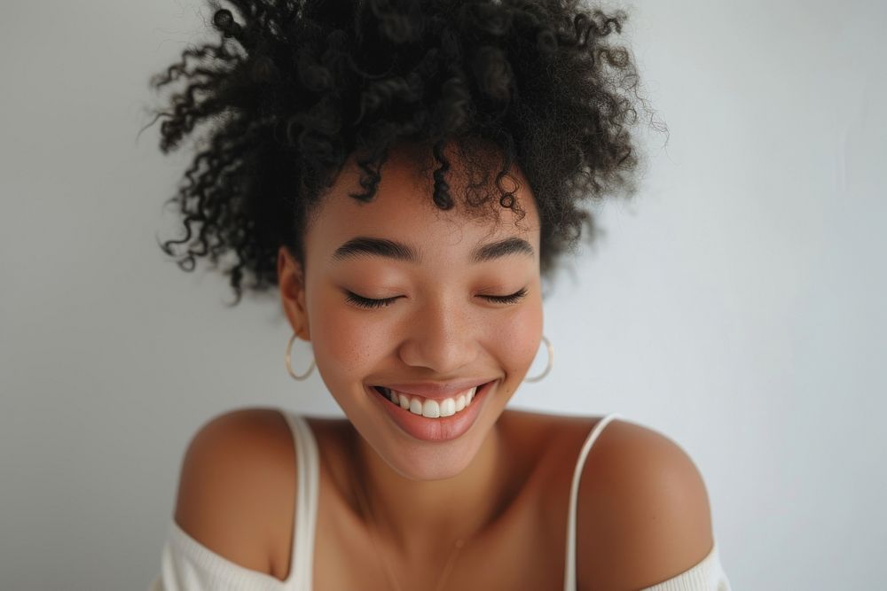 Black woman smile looking happy adult relaxation hairstyle.